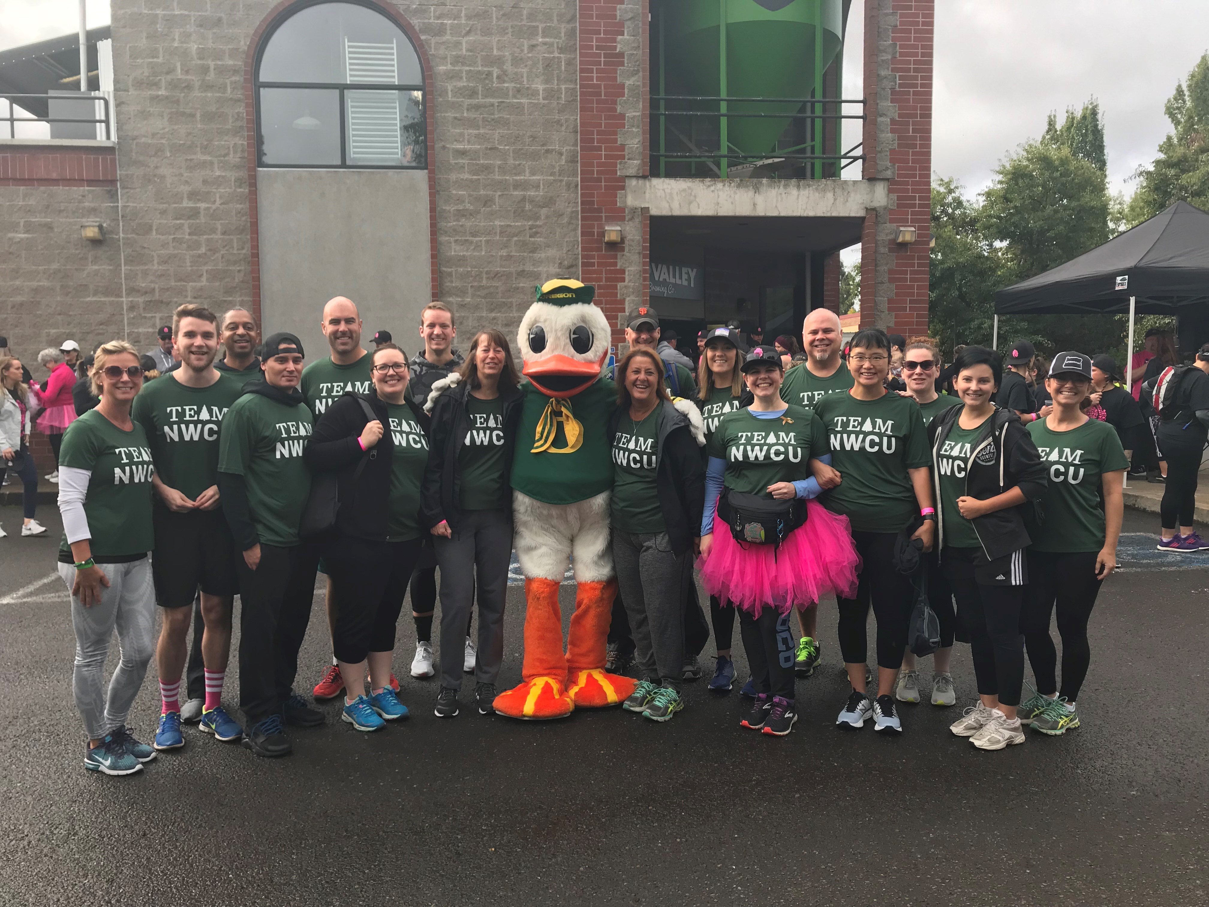 2019 Illuminati Private Bank Team with the Oregon Duck mascot at Hop to Hop